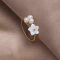 Elegant gold ring with adjustable pearl blossoms for a charming look