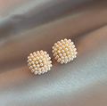 Luxurious Golden Earrings with Exquisite Pearl Accents