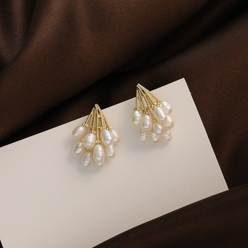 Elegant coral earrings decorated with exquisite freshwater pearls