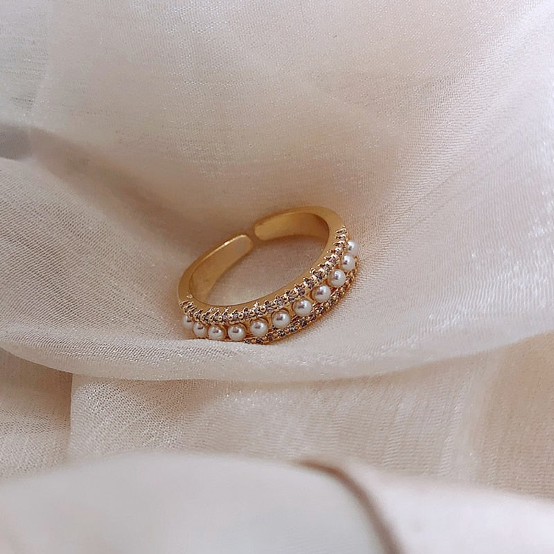 Elegant gold ring with noble pearl accents