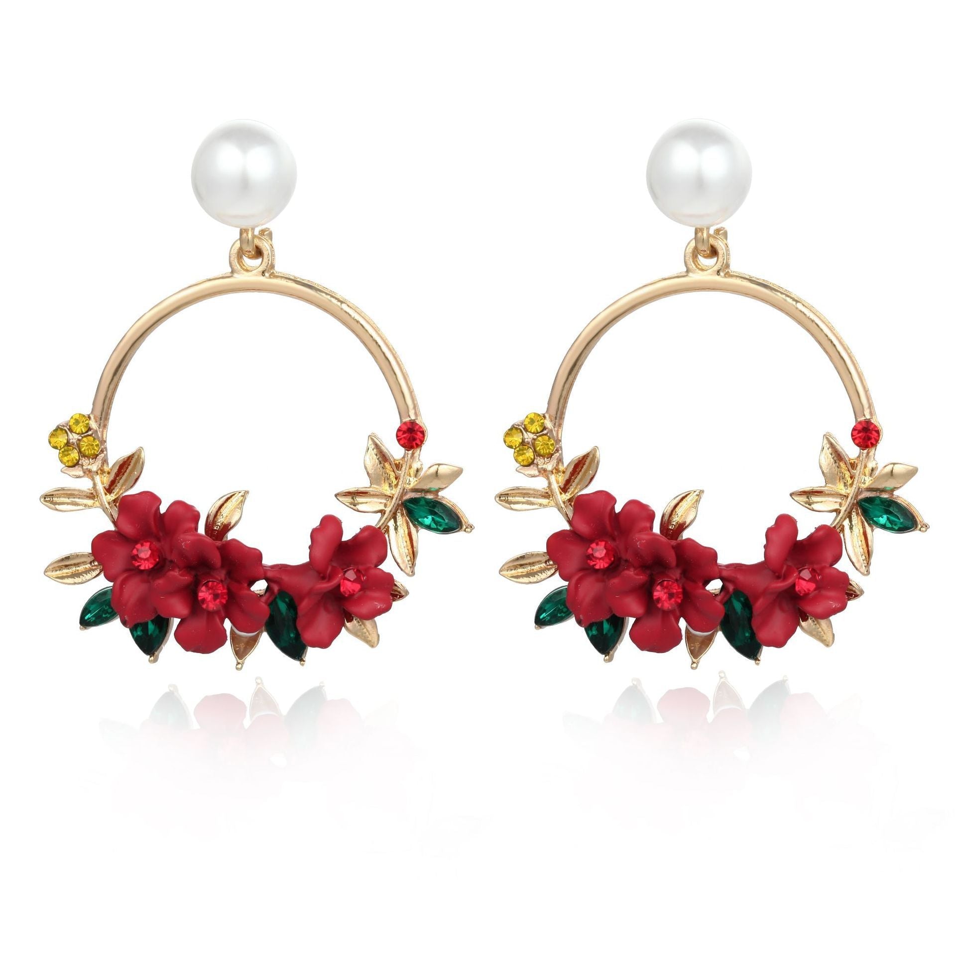 Elegant gold earrings with floral and pearl design