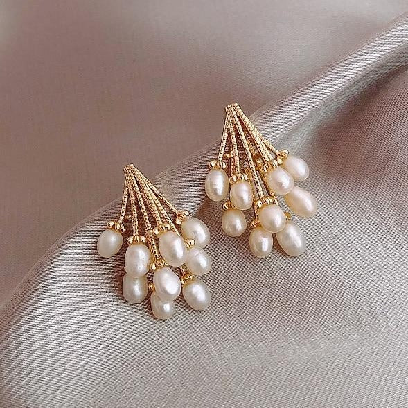 Elegant coral earrings decorated with exquisite freshwater pearls