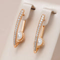 Stylish Gold Earrings with Sparkling Zirconia and Elegant Pearl