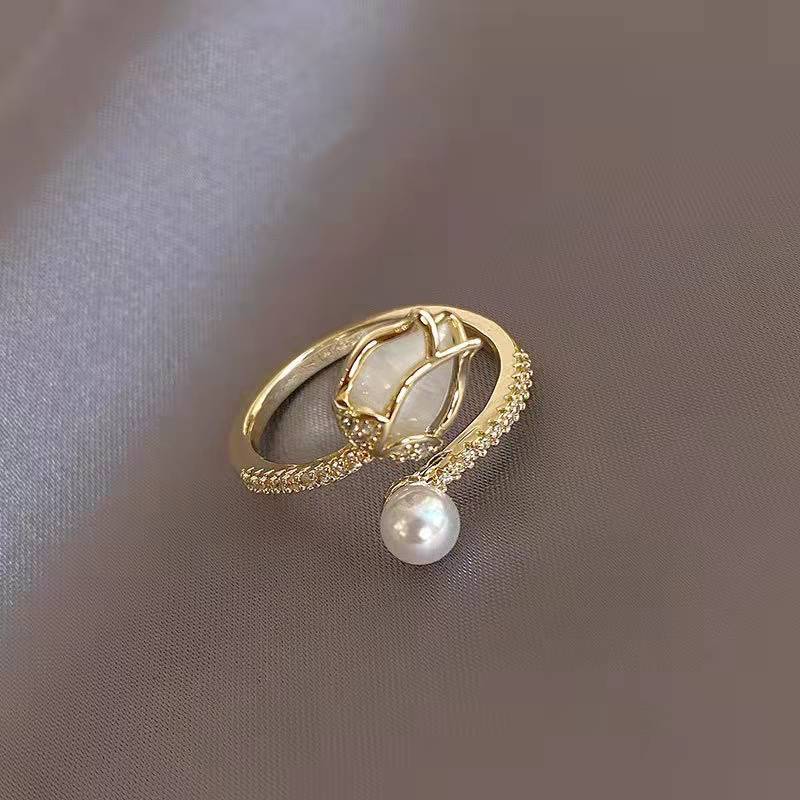 Elegant adjustable tulip ring in radiant white with dreamy pearl beauty and gold accents