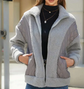 Stylish women's sherpa jacket with zipper and elegant quilted details