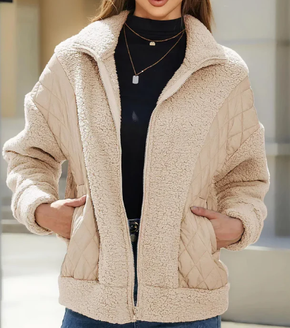 Stylish women's sherpa jacket with zipper and elegant quilted details