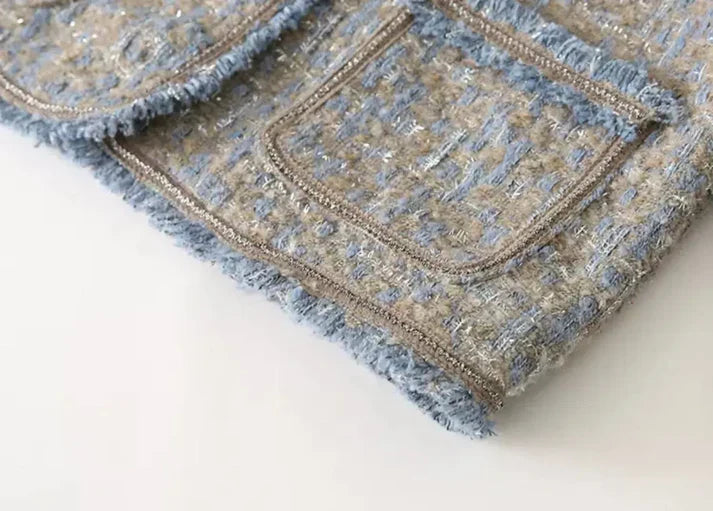 Elegant tweed jackets with fringes, button details, and practical pockets – stylish for women